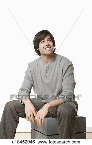 Studio portrait of young man View Large Photo Image Stock Photograph - Studio portrait of young man. Fotosearch