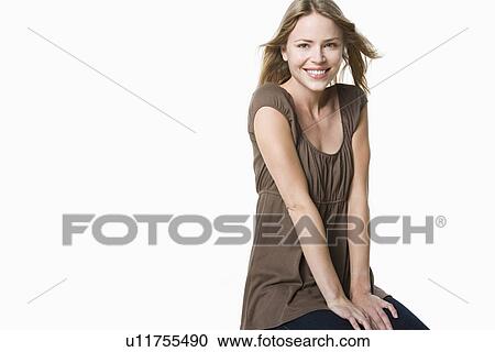 Studio portrait of young woman View Large Photo Image Stock Image - Studio portrait of young woman. Fotosearch