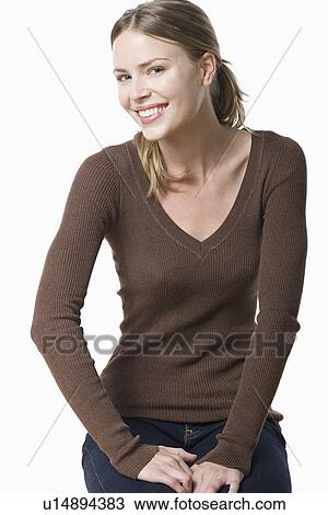 Stock Image - Studio portrait of young woman. Fotosearch
