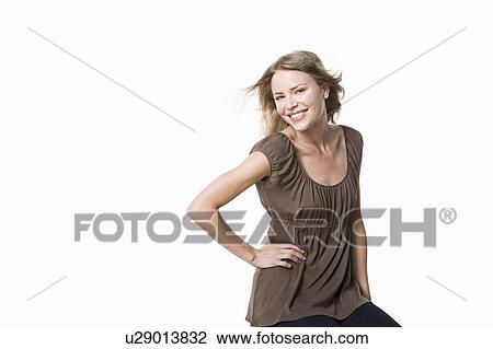 Stock Image - Studio portrait of young woman. Fotosearch
