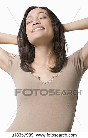 Stock Photo - Studio portrait of young woman. Fotosearch