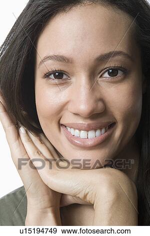 Stock Photo - Studio portrait of young woman. Fotosearch