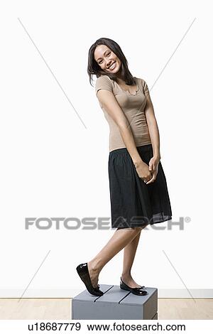 Stock Photo - Studio portrait of young woman. Fotosearch