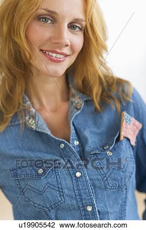 Studio portrait of young woman wearing denim jacket with US flag in pocket View Large Photo Image Stock Image - Studio portrait of young woman wearing denim jacket with US flag in pocket. Fotosearch