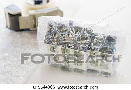 Studio shot of house wrapped in bubble wrap View Large Photo Image Stock Photograph - Studio shot of house wrapped in bubble wrap. Fotosearch