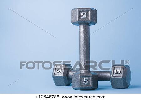 Stock Photography - Studio shot of metal dumbbells. Fotosearch