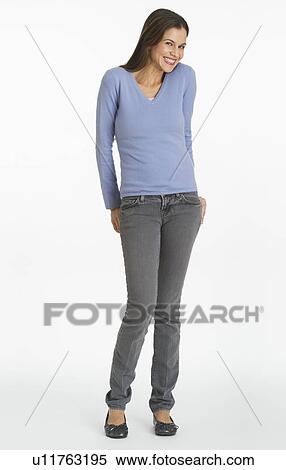 Studio shot of woman biting finger View Large Photo Image Stock Photography - Studio shot of woman biting finger. Fotosearch