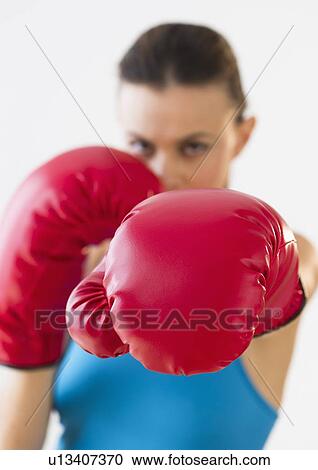 Studio shot of woman boxing View Large Photo Image Stock Image - Studio shot of woman boxing. Fotosearch