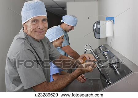 Stock Photo - Surgeons washing hands in hospital. Fotosearch