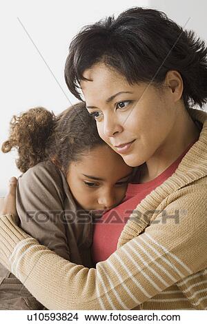 Picture - Teacher comforting girl (6-7). Fotosearch