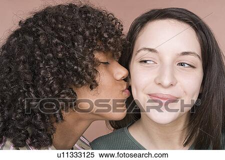 Teenage boy (14-15) kissing teenage girl (16-17) View Large Photo Image Stock Photography - Teenage boy (14-15) kissing teenage girl (16-17). Fotosearch