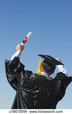 Picture - Teenage boy (16-17) at his graduation ceremony. Fotosearch