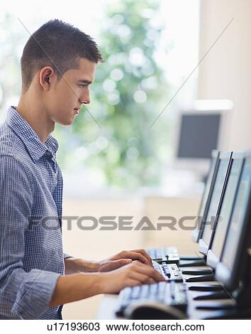 Teenage student (16-17) in computer lab View Large Photo Image Stock Image - Teenage student (16-17) in computer lab. Fotosearch