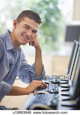 Teenage student (16-17) in computer lab View Large Photo Image Stock Photo - Teenage student (16-17) in computer lab. Fotosearch