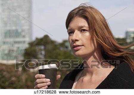 The Netherlands, Amsterdam, Portrait of businesswoman with coffee View Large Photo Image Stock Photo - The Netherlands, Amsterdam, Portrait of businesswoman with coffee. Fotosearch