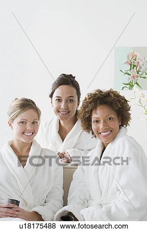 Three attractive women relaxing in spa View Large Photo Image Stock Photo - Three attractive women relaxing in spa. Fotosearch
