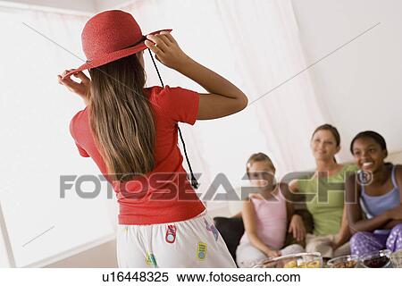 Three girls (10-11) and woman playing at slumber party View Large Photo Image Stock Photography - Three girls (10-11) and woman playing at slumber party. Fotosearch