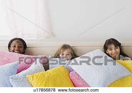 Three girls (10-11) having fun at slumber party View Large Photo Image Stock Photo - Three girls (10-11) having fun at slumber party. Fotosearch