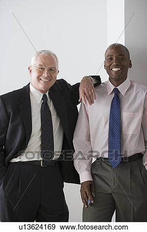 Stock Photo - Two businessmen smiling. Fotosearch