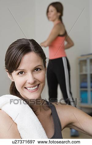 Two women exercising in gym View Large Photo Image Stock Photo - Two women exercising in gym. Fotosearch