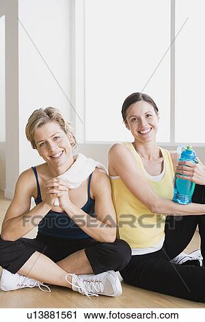 Two women in gym View Large Photo Image Stock Image - Two women in gym. Fotosearch