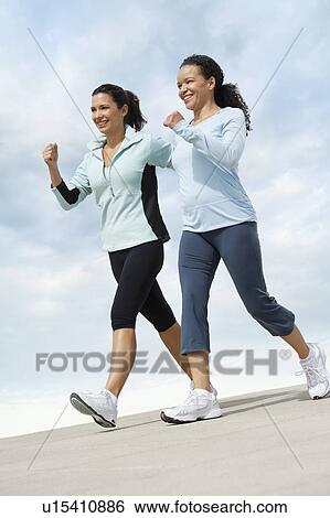 Two women jogging View Large Photo Image Stock Photograph - Two women jogging. Fotosearch