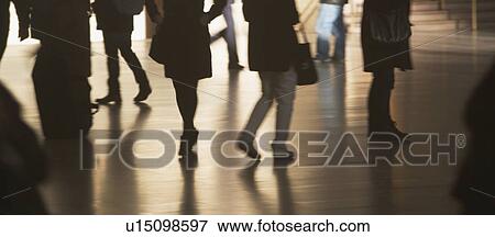 Urban scene with backlit pedestrians View Large Photo Image Stock Photo - Urban scene with backlit pedestrians . Fotosearch