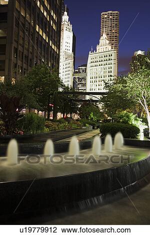 USA, Illinois, Chicago, Fountain and Wrigley Building illuminated at night View Large Photo Image Stock Image - USA, Illinois, Chicago, Fountain and Wrigley Building illuminated at night. Fotosearch
