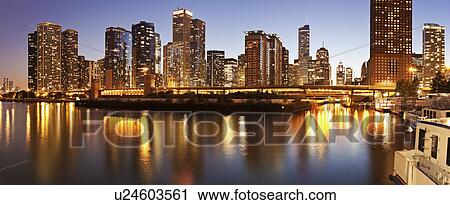 Stock Image - USA, Illinois, Chicago skyline at dusk. Fotosearch