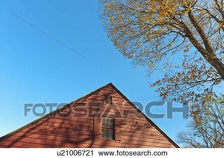 USA, New Jersey, Top of cottage house against blue sky View Large Photo Image Stock Image - USA, New Jersey, Top of cottage house against blue sky. Fotosearch