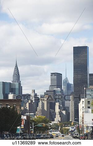 USA, New York City, Busy street with Manhattan skyline in background View Large Photo Image Stock Photo - USA, New York City, Busy street with Manhattan skyline in background. Fotosearch