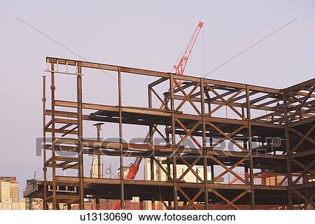 USA, New York City, Crane with unfinished built structure View Large Photo Image Stock Image - USA, New York City, Crane with unfinished built structure. Fotosearch