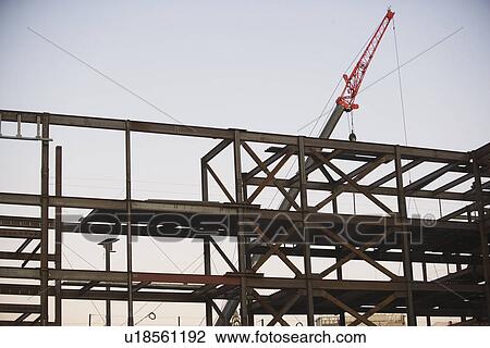 USA, New York City, Crane with unfinished built structure View Large Photo Image Stock Image - USA, New York City, Crane with unfinished built structure. Fotosearch