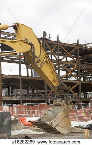 Stock Photo - USA, New York City, Digger at construction site. Fotosearch