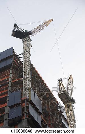 Stock Photo - USA, New York City, Modern office building under construction. Fotosearch