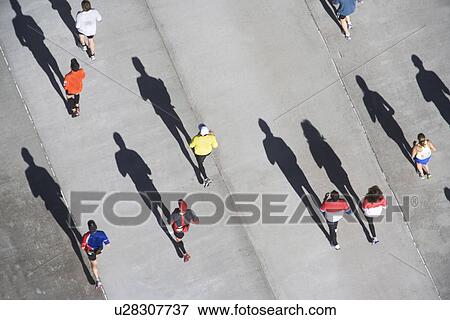Stock Photo - USA, New York City, New York City Marathon as seen from above. Fotosearch