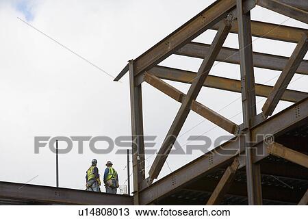 USA, New York City, Two construction workers at construction site View Large Photo Image Stock Image - USA, New York City, Two construction workers at construction site. Fotosearch