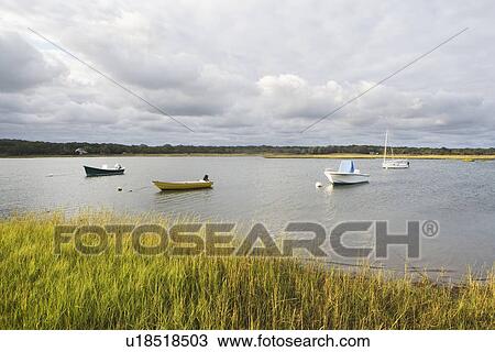 Stock Image - USA, New York, Long Island, East Hampton, Boats floating on lake. Fotosearch
