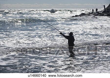 USA, New York, Long Island, Montaurk, Man fishing in sea View Large Photo Image Stock Image - USA, New York, Long Island, Montaurk, Man fishing in sea. Fotosearch