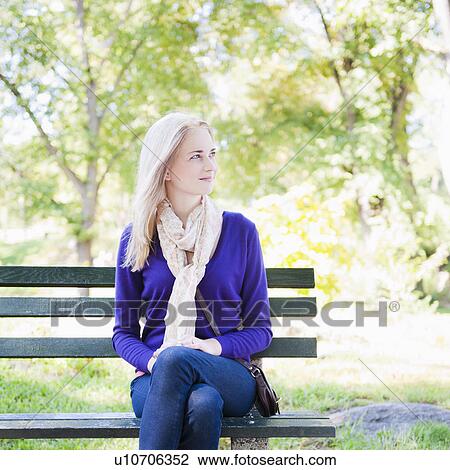USA, New York, New York City, Manhattan, Central Park, Young woman sitting on bench View Large Photo Image Stock Image - USA, New York, New York City, Manhattan, Central Park, Young woman sitting on bench. Fotosearch