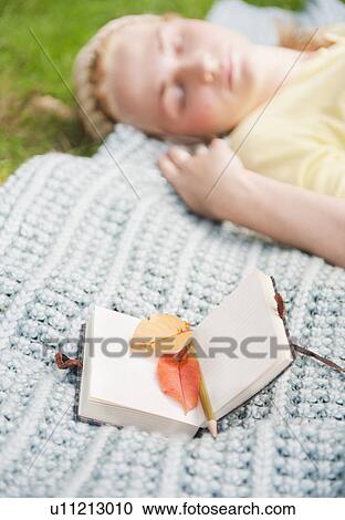 USA, New York, New York City, Manhattan, Central Park, Woman sleeping in park View Large Photo Image Stock Image - USA, New York, New York City, Manhattan, Central Park, Woman sleeping in park. Fotosearch