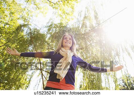 USA, New York, New York City, Manhattan, Central Park, Young woman practicing yoga View Large Photo Image Stock Image - USA, New York, New York City, Manhattan, Central Park, Young woman practicing yoga. Fotosearch