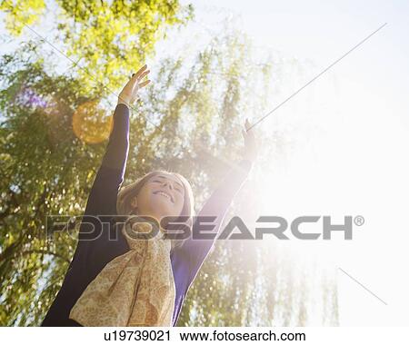 USA, New York, New York City, Manhattan, Central Park, Young woman practicing yoga View Large Photo Image Stock Image - USA, New York, New York City, Manhattan, Central Park, Young woman practicing yoga. Fotosearch