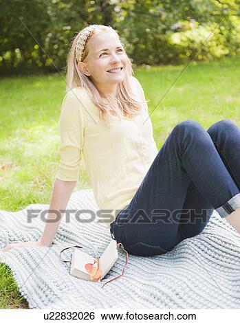 USA, New York, New York City, Manhattan, Central Park, Woman relaxing on grass View Large Photo Image Stock Photograph - USA, New York, New York City, Manhattan, Central Park, Woman relaxing on grass. Fotosearch
