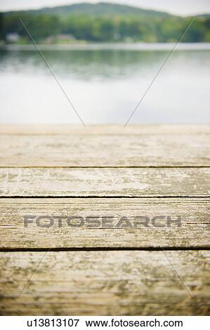 Stock Photo - USA, New York, Putnam Valley, Roaring Brook Lake, Close up of wooden pier at lake. Fotosearch