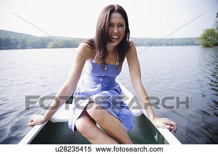 USA, New York, Putnam Valley, Roaring Brook Lake, Woman sitting in boat View Large Photo Image Stock Photography - USA, New York, Putnam Valley, Roaring Brook Lake, Woman sitting in boat. Fotosearch