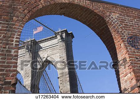 USA, New York State, New York City, Arch and Brooklyn Bridge in background View Large Photo Image Picture - USA, New York State, New York City, Arch and Brooklyn Bridge in background. Fotosearch