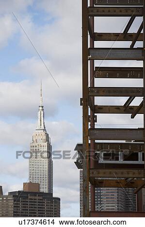 USA, New York State, New York City, Construction site and skyscrapers in background View Large Photo Image Picture - USA, New York State, New York City, Construction site and skyscrapers in background. Fotosearch