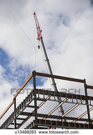 USA, New York State, New York City, Cranes on cloudy sky View Large Photo Image Stock Image - USA, New York State, New York City, Cranes on cloudy sky. Fotosearch