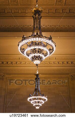 Stock Image - USA, New York State, New York City, Chandelier in Grand Central Station. Fotosearch